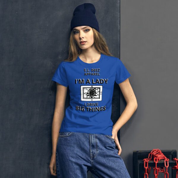 a woman wearing I DRIVE BIG THINGS Blue color t shirt